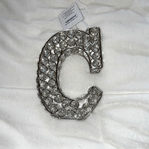 Bedazzled stand up “C” decoration